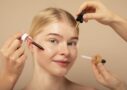 close up woman with beauty products min scaled